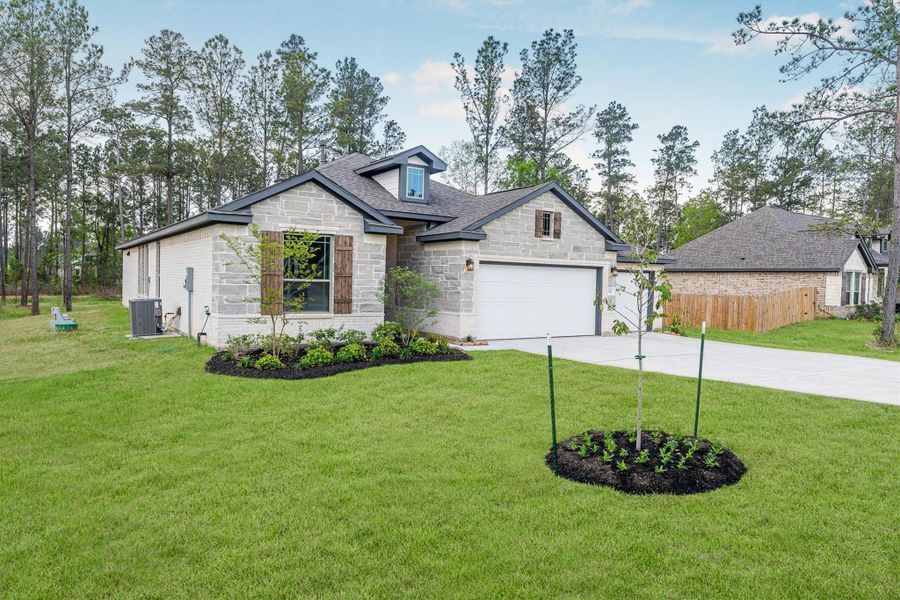 Front exterior of a new home in Deer Pines, Conroe, TX, highlighting curb appeal (Image 20).