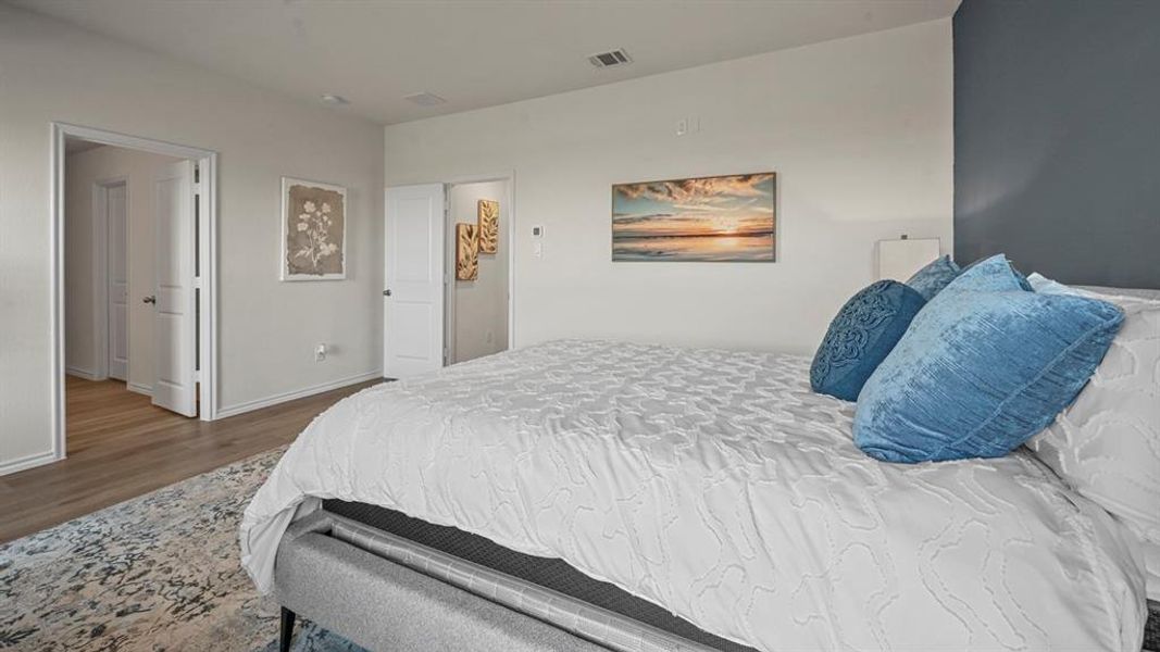 Wood-finish flooring with a contrasting area rug Wood-finish flooring with a contrasting area rug