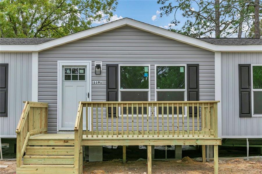 Exterior details and patio area of a home in , Williston (Image 27).