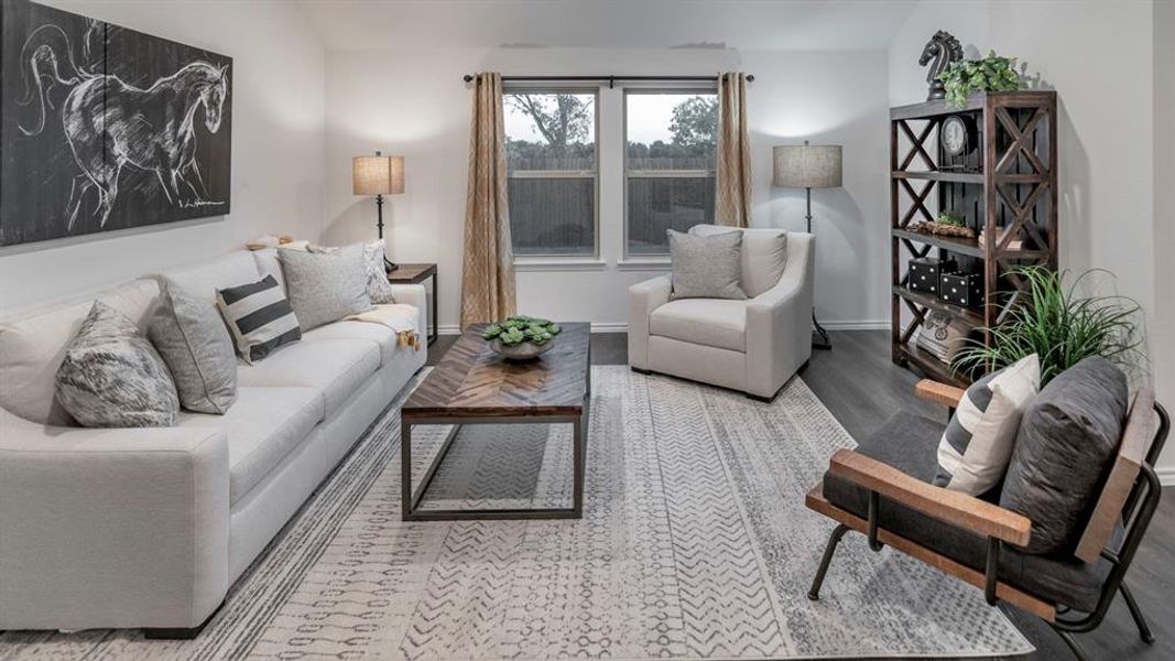 Living room featuring lofted ceiling and light wood-style floors