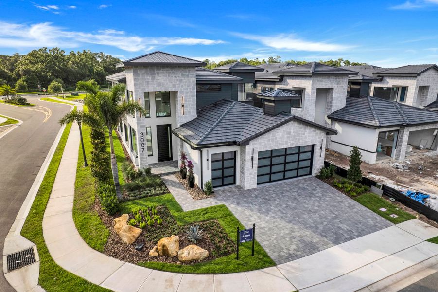 Front exterior of a new home in Hampton Green at Providence, Davenport, FL, highlighting curb appeal (Image 7).