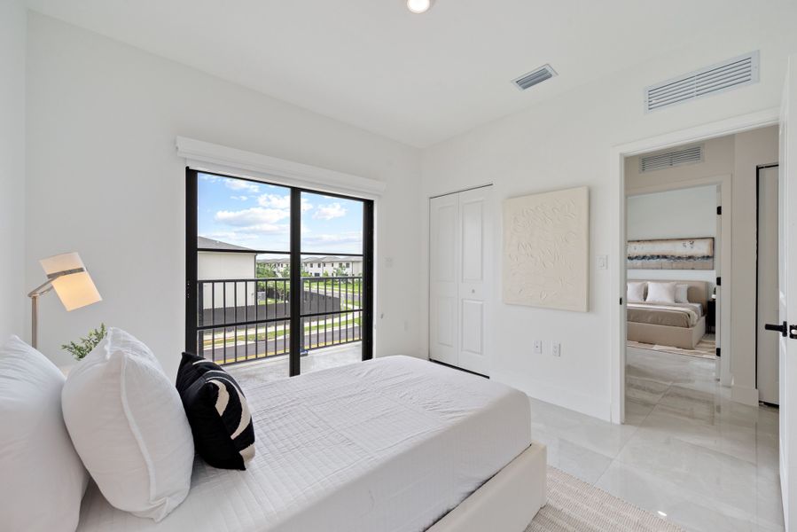 Representative furnished interior of a home built from the Model E by Onx Homes in On Alba, Florida City (Image 53).