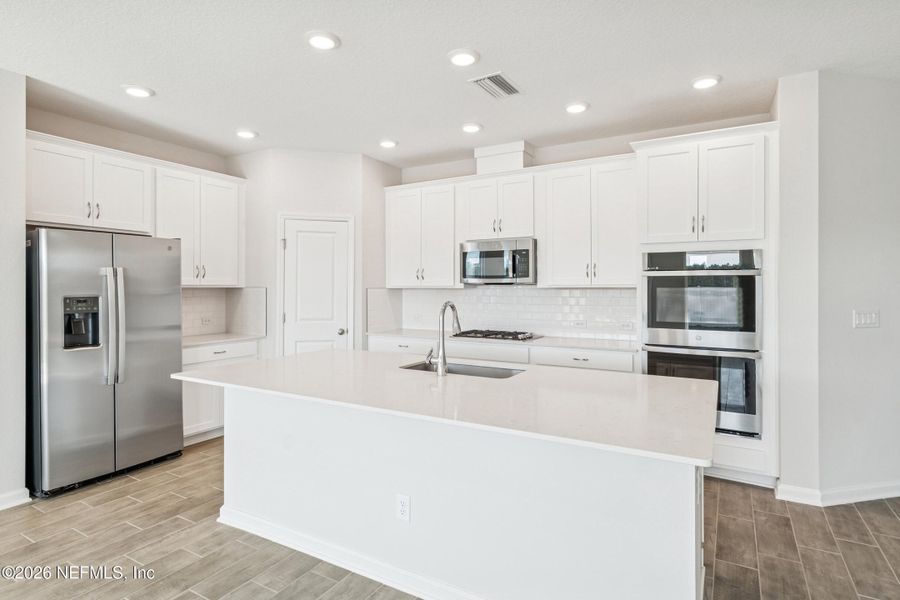 Furnished interior view inside a new home in Tributary 50', Yulee (Image 5).