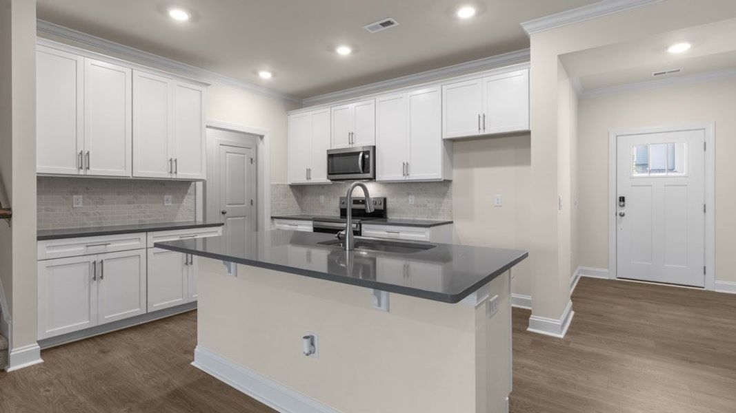 Representative furnished interior of a home built from the Linville by D.R. Horton in The Meadows at Kinsley, Jamestown (Image 6).
