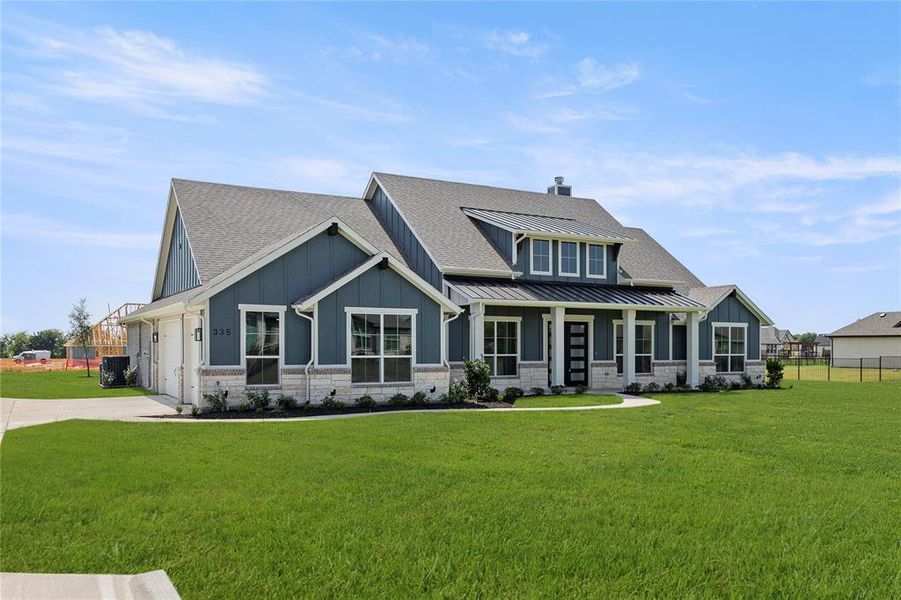 Front exterior of a new home in The Meadows, Gunter, TX, highlighting curb appeal (Image 20).