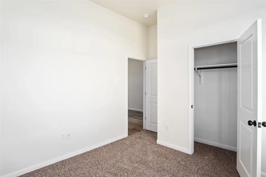 Minor bedroom with closet Minor bedroom with closet