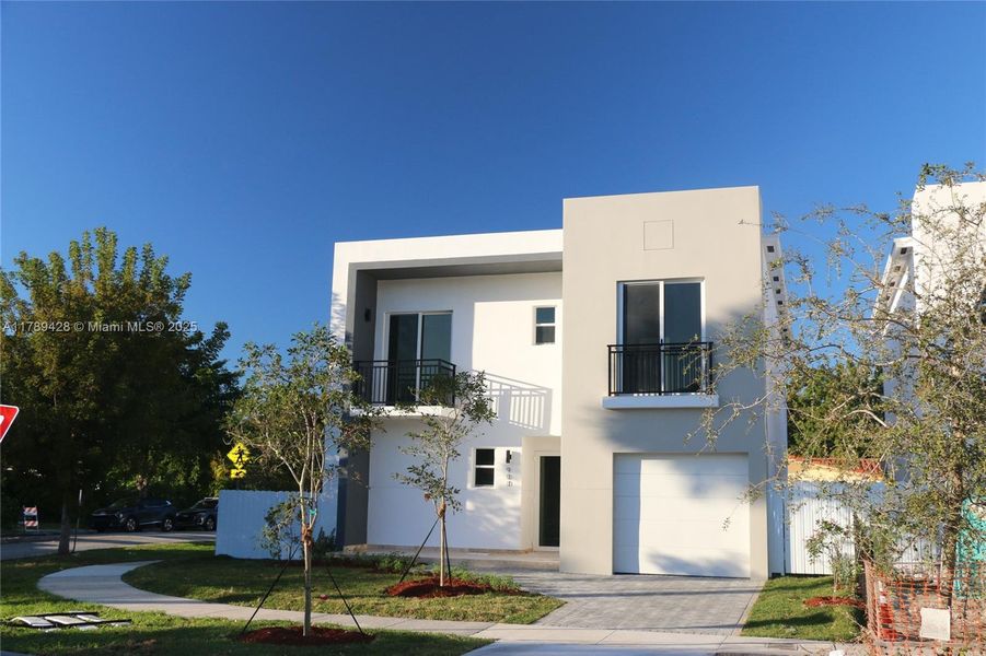 Front exterior of a new home in , Miami, FL, highlighting curb appeal (Image 1). Front exterior of a new home in , Miami, FL, highlighting curb appeal (Image 1).
