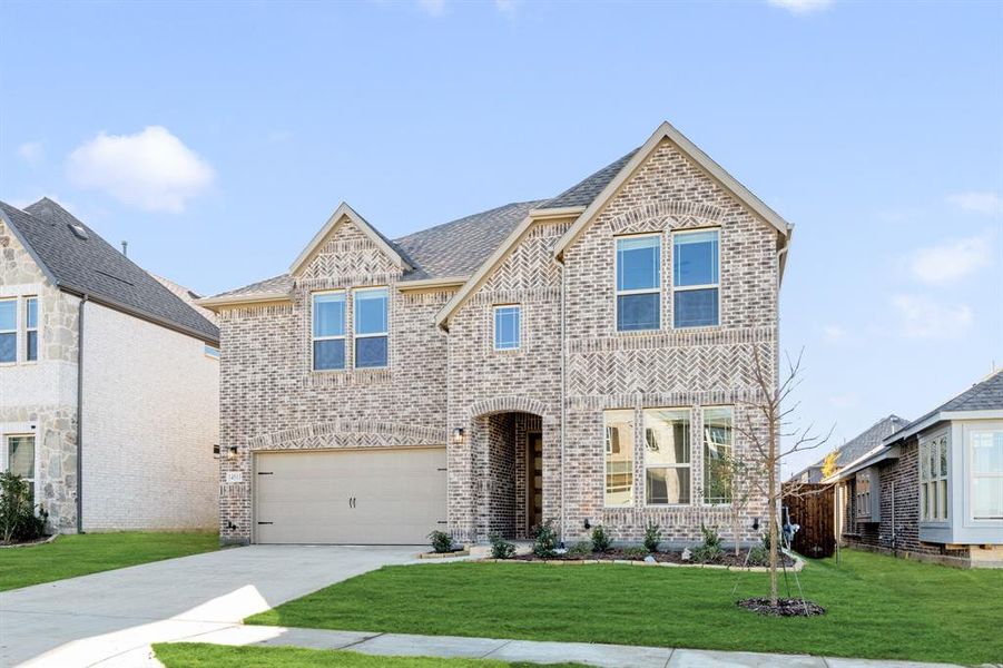 Front exterior of a new home in Creekview Meadows, Pilot Point, TX, highlighting curb appeal (Image 1).