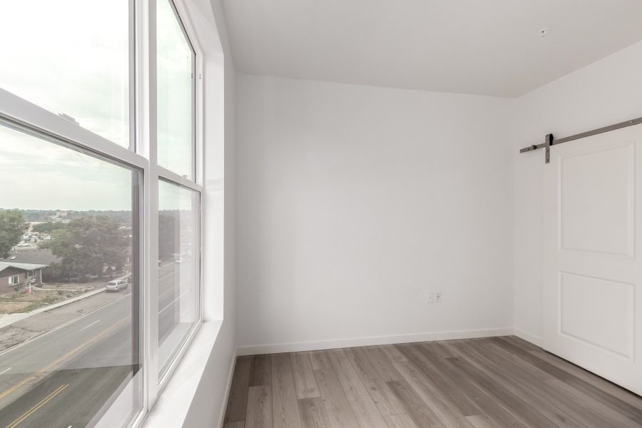 Spacious, unfurnished interior of a new home in The Scene at Sloan's Lake, Denver (Image 11).