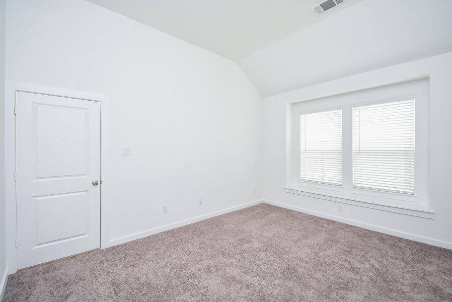 Let the sun wake you in the morning and the rich, dark skies of night lull you to sleep in this spacious primary suite.