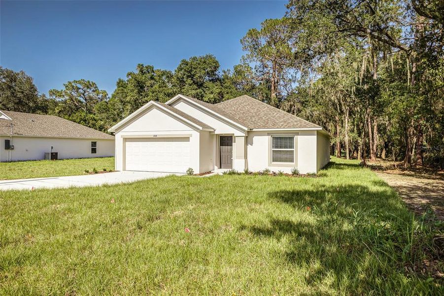 Front exterior of a new home in , Winter Haven, FL, highlighting curb appeal (Image 14).