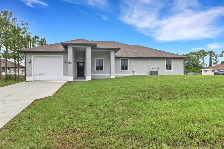 Front exterior of a new home in , Lehigh Acres, FL, highlighting curb appeal (Image 1). Front exterior of a new home in , Lehigh Acres, FL, highlighting curb appeal (Image 1).