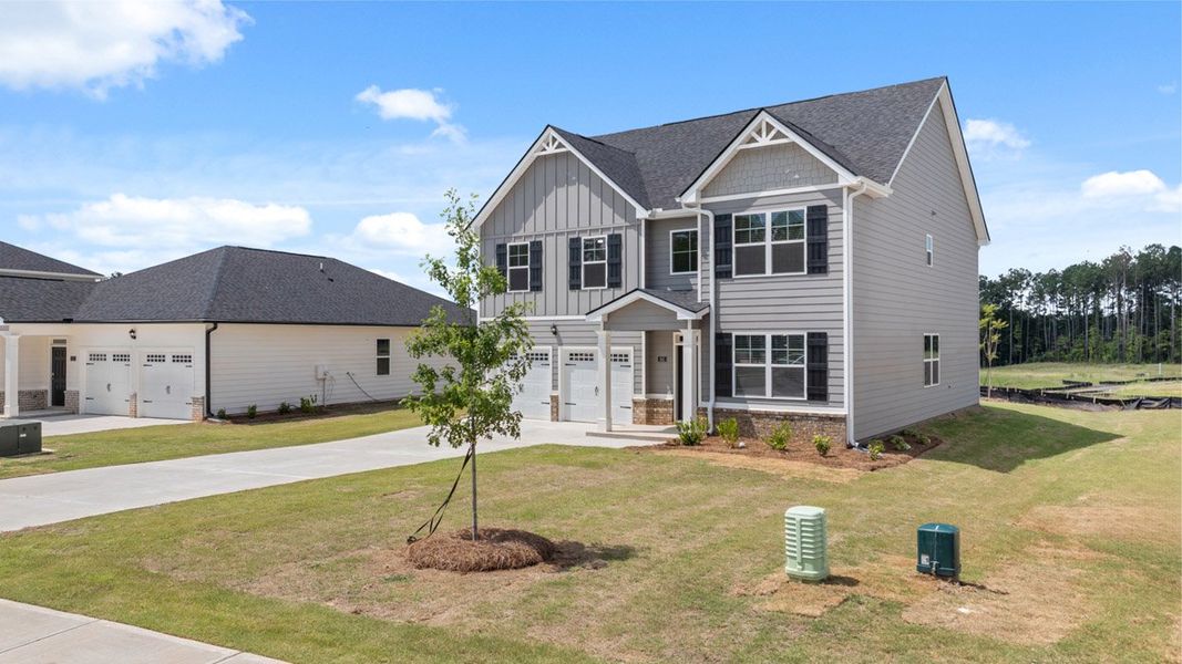 Representative exterior photo of a completed home built from the Packard by D.R. Horton in Glenmaye, Hampton, GA (Image 21).