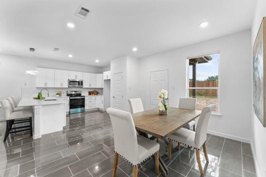 Dining area featuring recessed lighting and baseboards Dining area featuring recessed lighting and baseboards