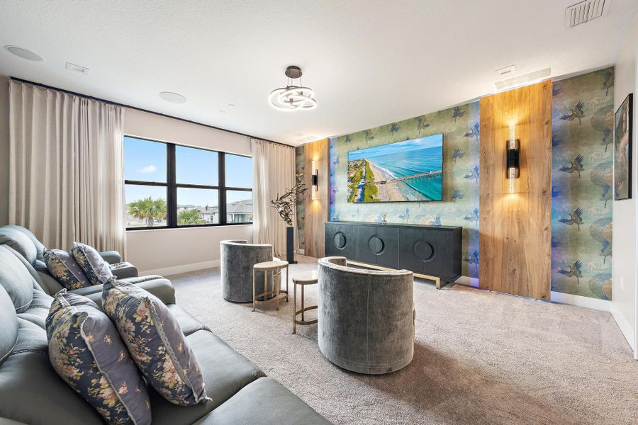 Designer-approved decorative wall with custom lighting and surround sound speakers in the ceiling.