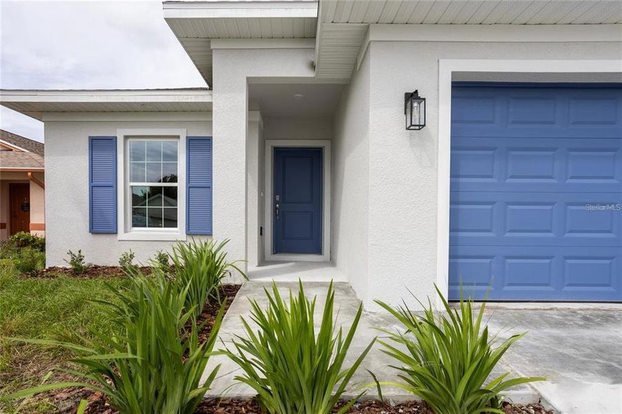 Front exterior of a new home in , Port Charlotte, FL, highlighting curb appeal (Image 24). Front exterior of a new home in , Port Charlotte, FL, highlighting curb appeal (Image 24).