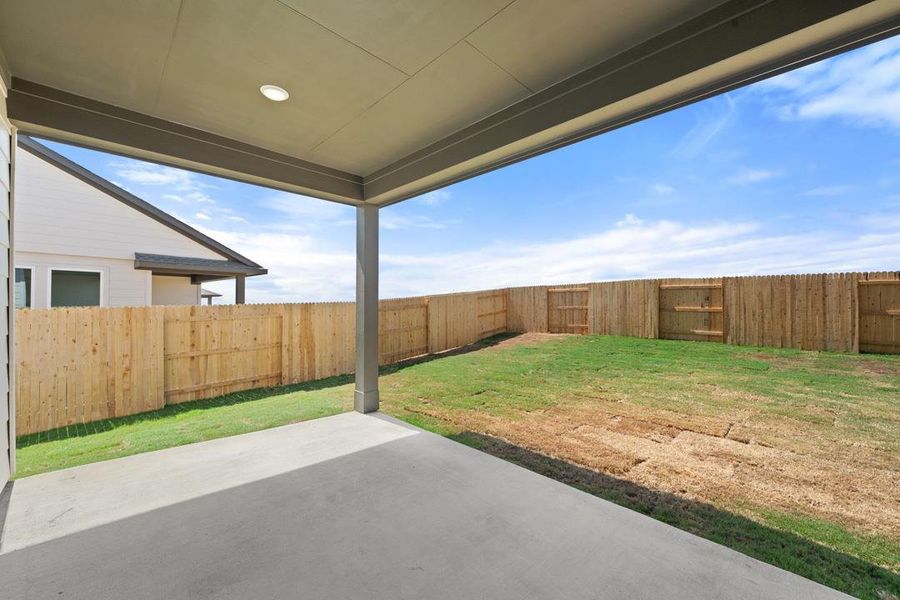 Exterior details and patio area of a home in Terrace Collection At Turner's Crossing, Buda (Image 22).