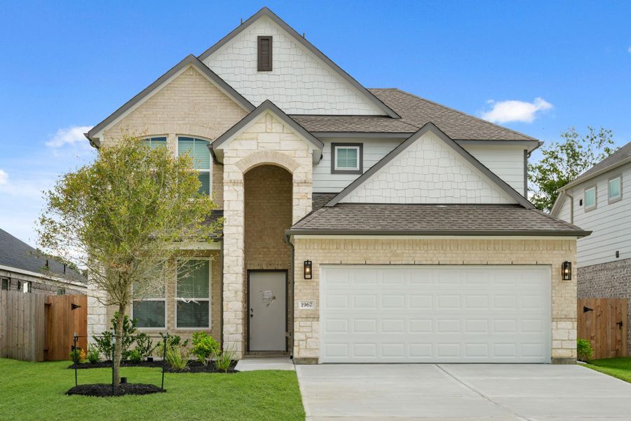 Front exterior of a new home in Barton Creek Ranch, Conroe, TX, highlighting curb appeal (Image 2). Front exterior of a new home in Barton Creek Ranch, Conroe, TX, highlighting curb appeal (Image 2).