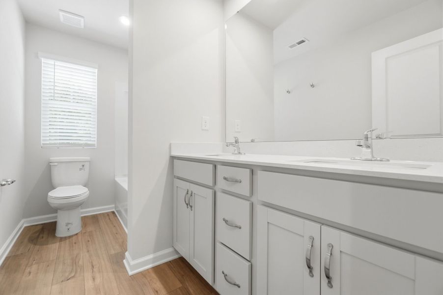 Furnished interior view inside a new home in Stonesummit at Reedy Creek, Charlotte (Image 10).