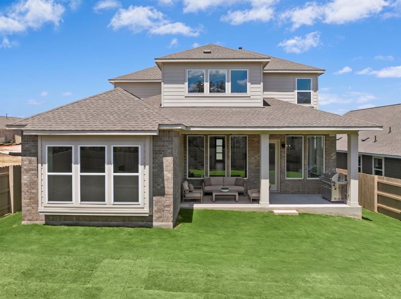 Exterior details and patio area of a home in The Colony, Bastrop (Image 3).