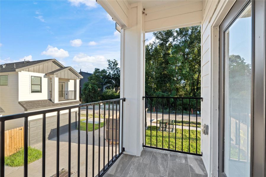 Step out to your tile-floored balcony—iron railing, treetop views, and an easy spot for morning coffee or an evening wind-down; zero fuss, low-maintenance living. Step out to your tile-floored balcony—iron railing, treetop views, and an easy spot for morning coffee or an evening wind-down; zero fuss, low-maintenance living.