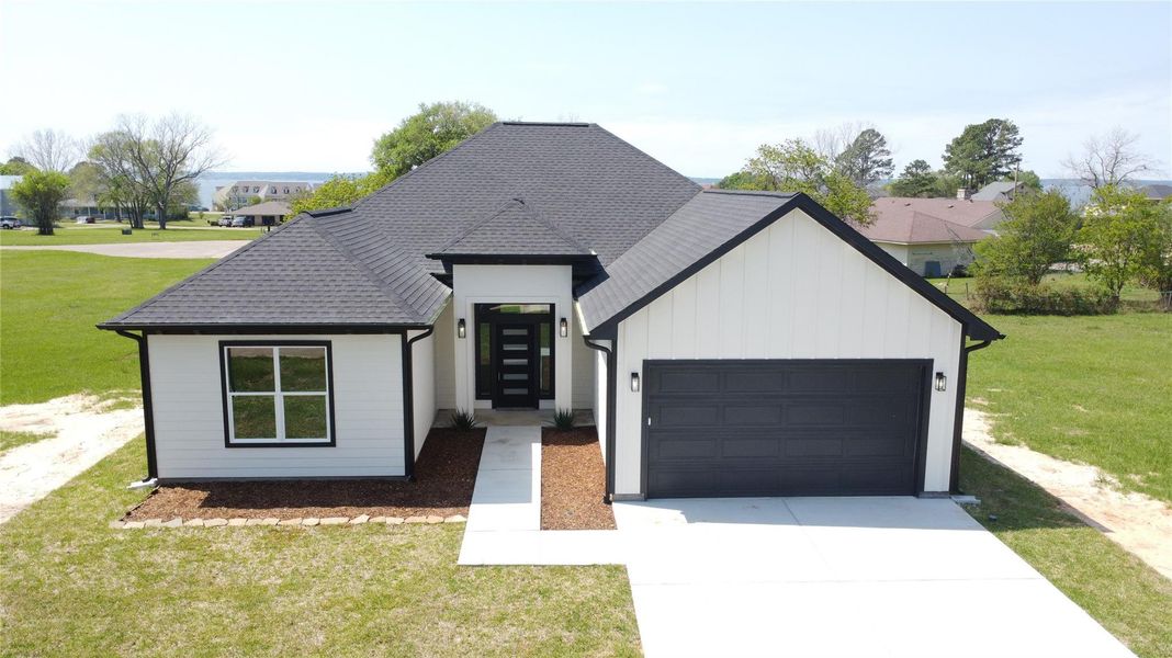 Front exterior of a new home in , Livingston, TX, highlighting curb appeal (Image 1). Front exterior of a new home in , Livingston, TX, highlighting curb appeal (Image 1).