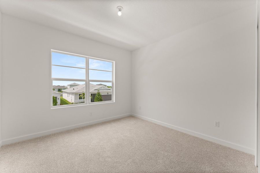 Spacious, unfurnished interior of a new home in Tradition - Cadence, Port St. Lucie (Image 21).