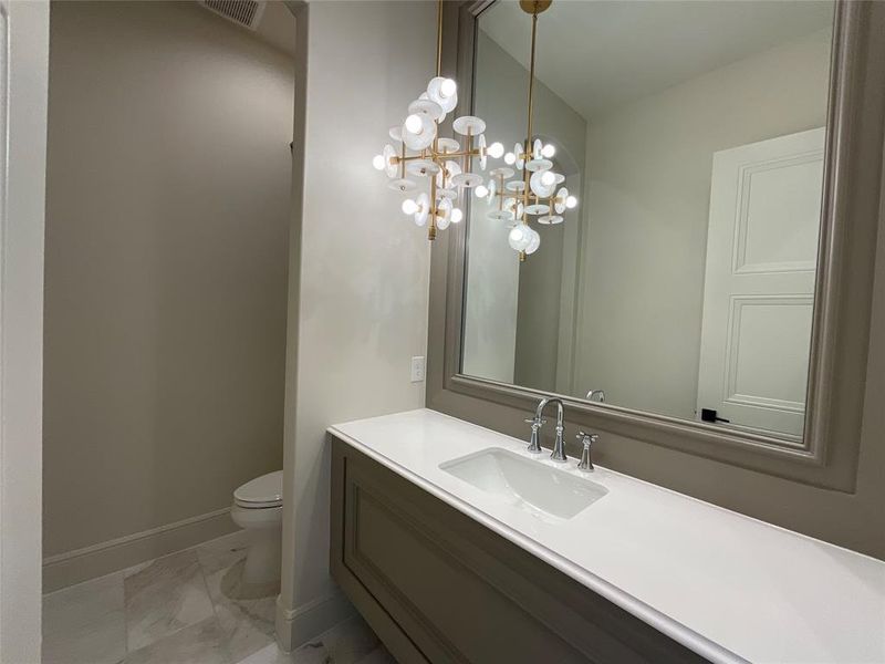 Bathroom with vanity and toilet