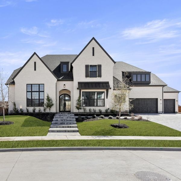 Front exterior of a new home in Mustang Lakes, Celina, TX, highlighting curb appeal (Image 29). Front exterior of a new home in Mustang Lakes, Celina, TX, highlighting curb appeal (Image 29).