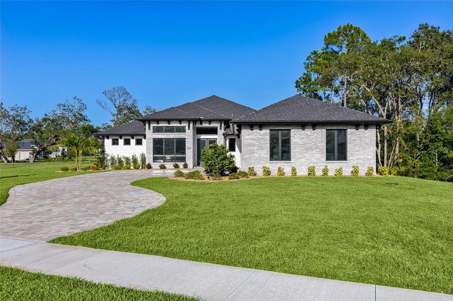 Front exterior of a new home in , New Smyrna Beach, FL, highlighting curb appeal (Image 21). Front exterior of a new home in , New Smyrna Beach, FL, highlighting curb appeal (Image 21).
