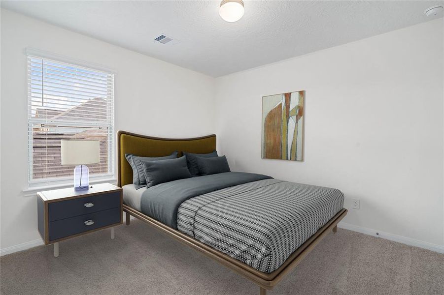 Secondary bedroom features plush carpet, neutral paint, lighting, a large window with privacy blinds and ample sized closet space.