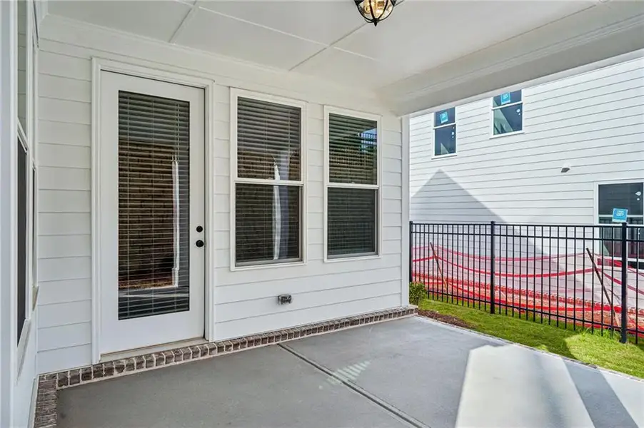 Exterior details and patio area of a home in Promenade at Sawnee Village, Cumming (Image 3).