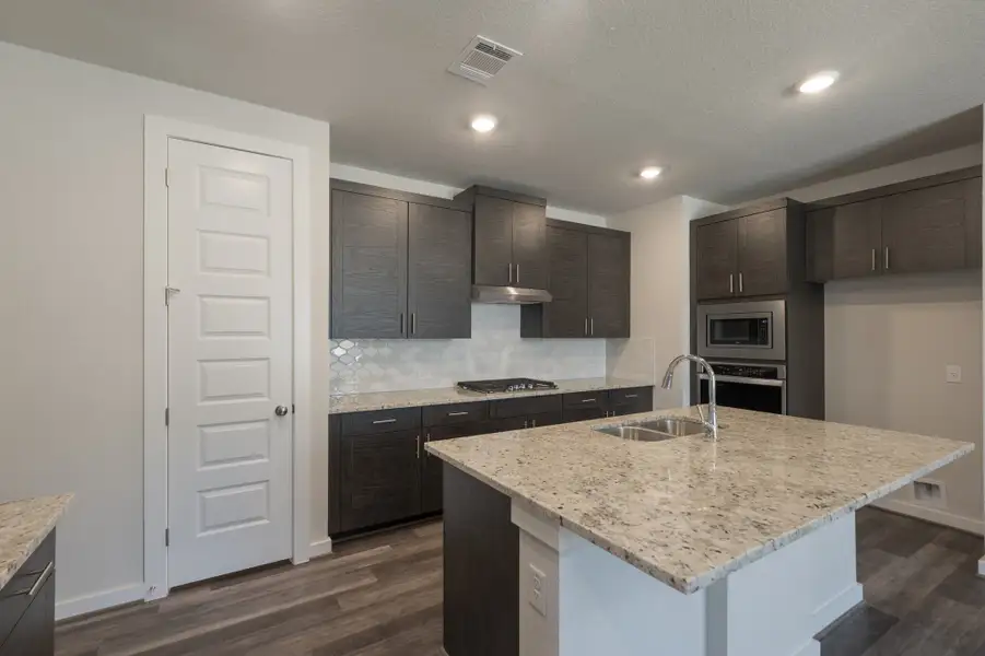 Representative furnished interior of a home built from the Pleasanton by Scott Felder Homes in Flora, Hutto (Image 3).