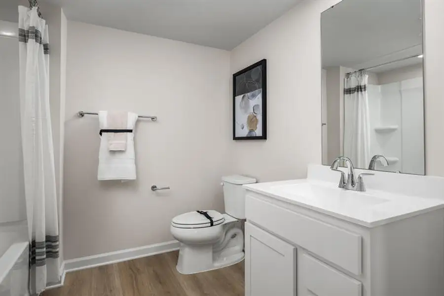 Representative furnished interior of a home built from the Beech by Ryan Homes in Highland Park Condos, White House (Image 13).