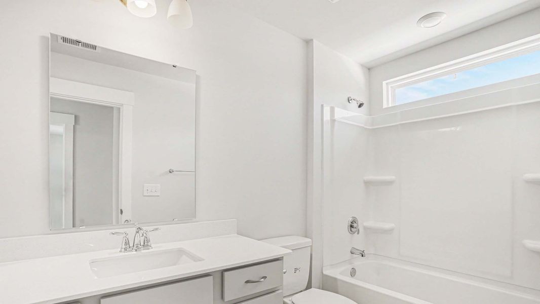 Representative furnished interior of a home built from the Mackenzie2 by D.R. Horton in Chapman Village, Conway (Image 6).