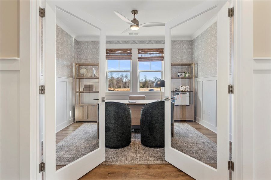 This bright office space features large windows an