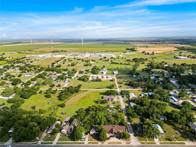 Aerial overview of property's location with nearby suburban area Aerial overview of property's location with nearby suburban area