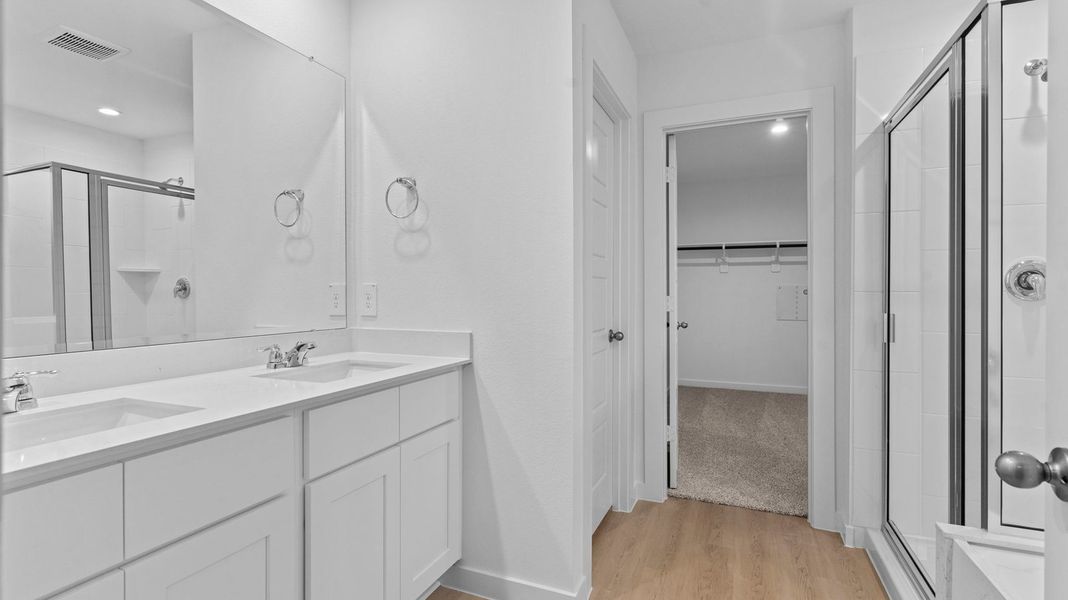 Furnished interior view inside a new home in Caldwell Crossing, Iowa Colony (Image 8).
