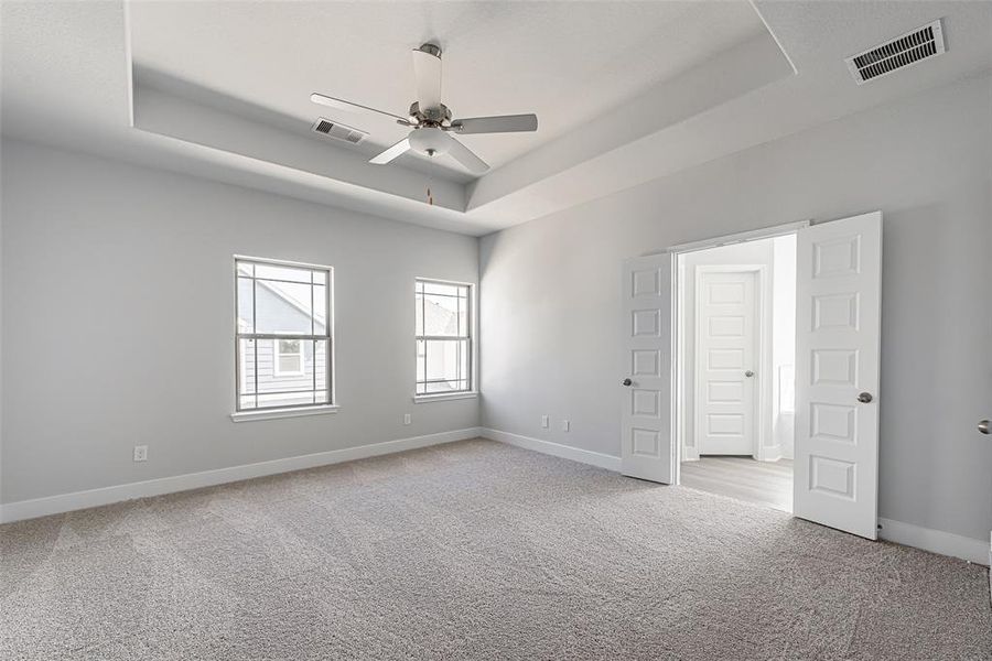 Primary Bathroom is oversized with tray ceiling