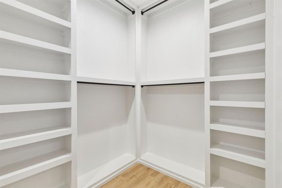 Walk in closet featuring hardwood / wood-style floors