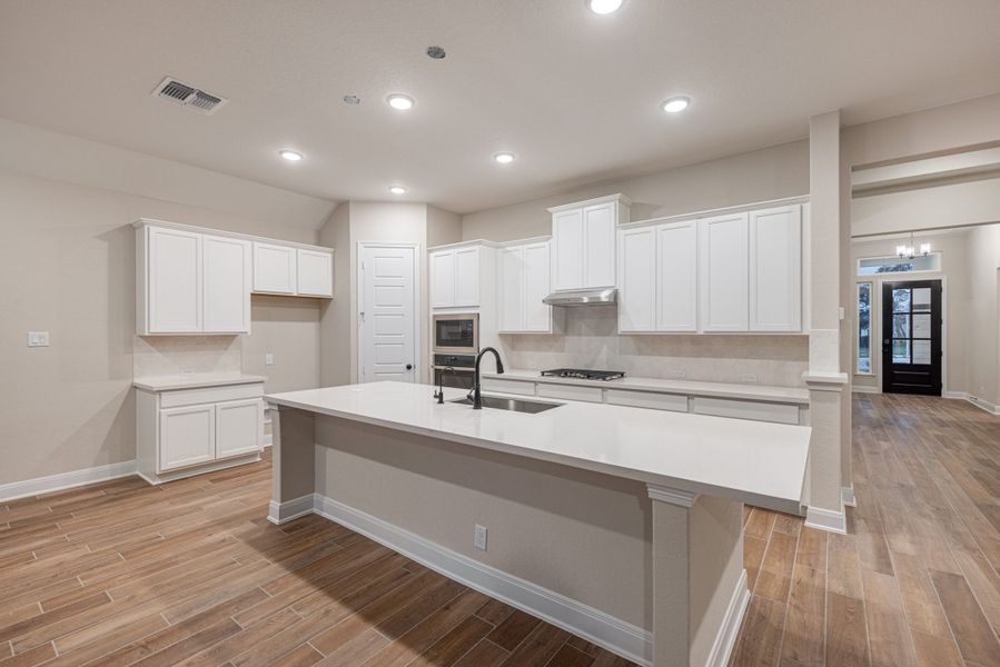 Representative furnished interior of a home built from the Mackenzie by Chesmar Homes in Sienna Lakes, San Antonio (Image 4).