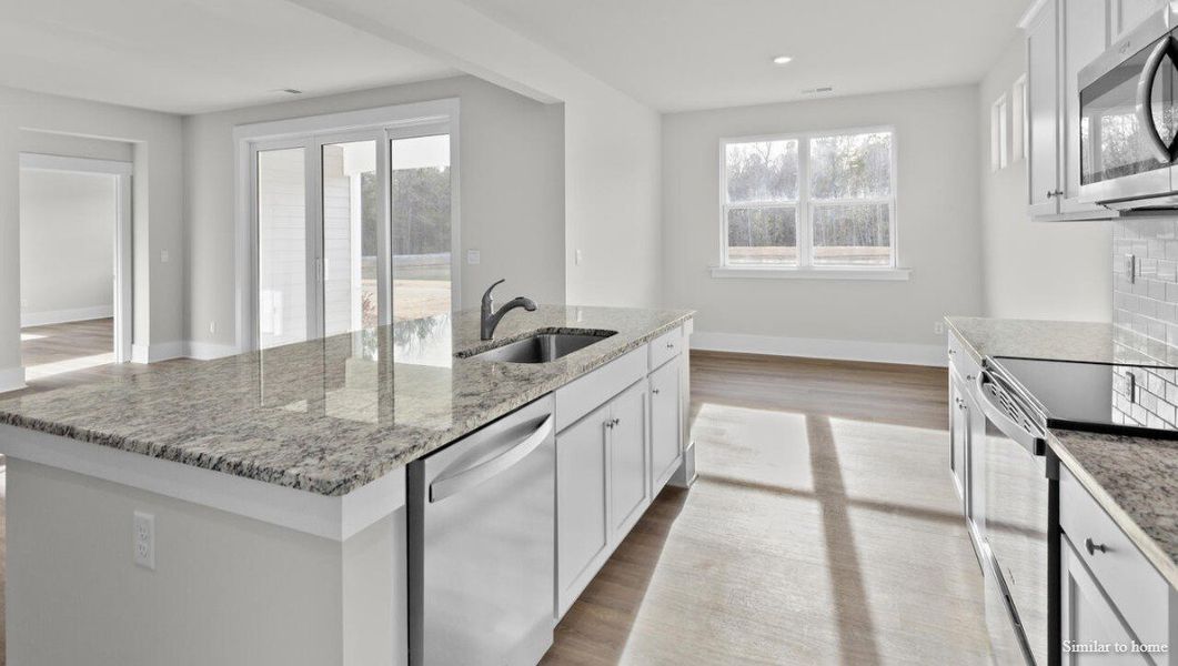 Representative furnished interior of a home built from the Martin by D.R. Horton in Merchant Point, Jacksonville (Image 10).