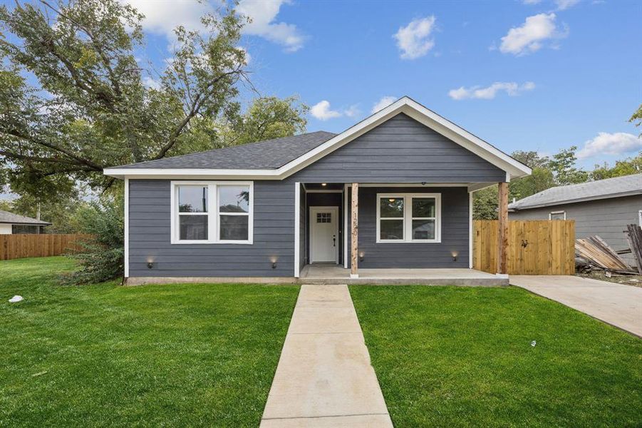 Bungalow with covered porch and roof with shingles