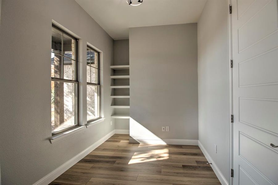 Spare room featuring dark hardwood / wood-style floors