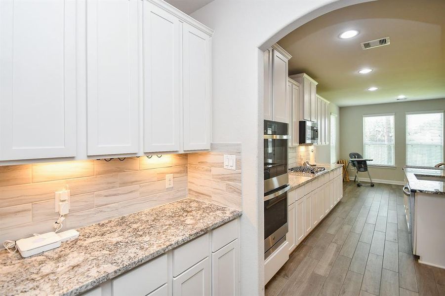 Butler's pantry offers additional storage and counter space. You can also see the double oven.