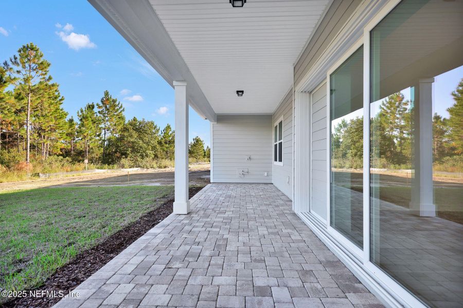 Exterior details and patio area of a home in The Landings at Saint Johns, St. Johns (Image 16).