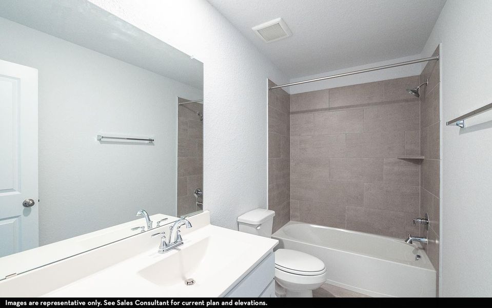 Well appointed upstairs secondary bathroom featuring a spacious vanity with ample counter space, large mirror, and a convenient tub and shower combination with modern tile surround, offering comfort and functionality for family members and guests. **Photos are representative only and may vary as built.** Well appointed upstairs secondary bathroom featuring a spacious vanity with ample counter space, large mirror, and a convenient tub and shower combination with modern tile surround, offering comfort and functionality for family members and guests. **Photos are representative only and may vary as built.**
