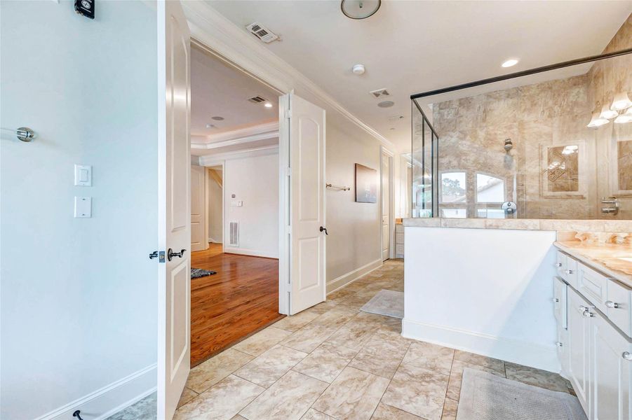 PRIMARY BATH WITH TWO SEPARATE VANITIES, DUAL HEAD SHOWER WITH BENCH, LINEN CLOSET, PRIVATE TOILET, TWO WALK-IN CLOSETS