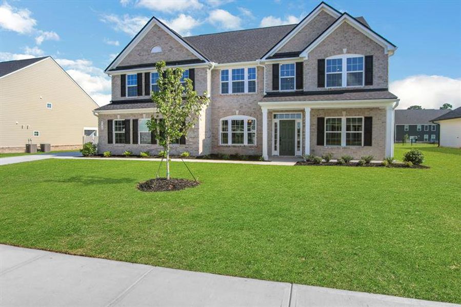 Front exterior of a new home in Edinburgh, Locust Grove, GA, highlighting curb appeal (Image 2).