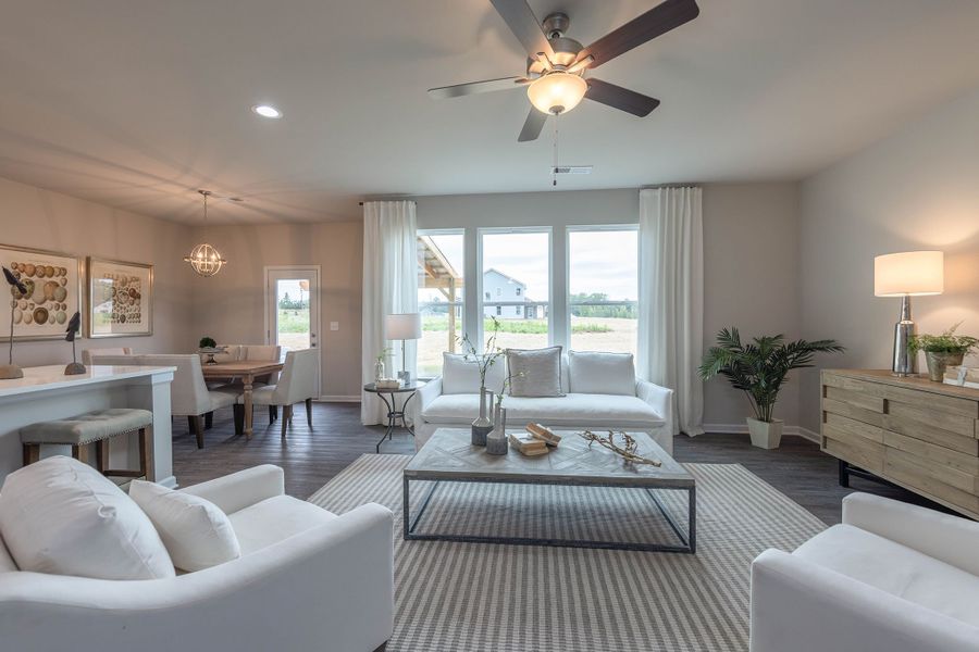 Family room with large windows overlooking backyard